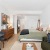 studio bedroom layout with bed and seating area 