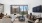 Large well lit living room with oversized windows